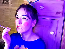 asian stepsister smokes a cigarette