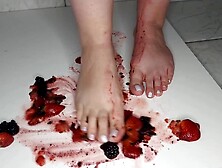 Hispanic wifey Steps on dark berries while hubby watches.