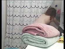 Hidden hairy redhead taking a shower
