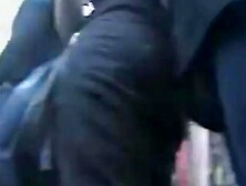 Candid up skirt voyeur tries his luck at the town fair.