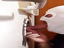 Ski-Masked Stud Sucking A Cock Through A Glory Hole