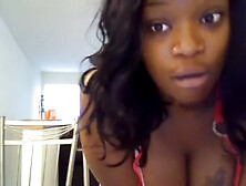 Black chick perform a seducing dance in front of a webcam