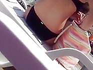 Sexy girl with bikini undressing at beach