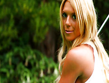 Jessica Marie Love poses on the green field of grass