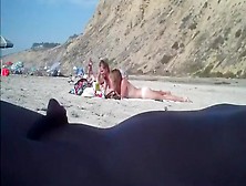 2 girls make fun with a guy's microdick on a nudist beach