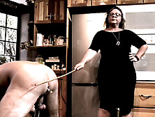 Dominatrix April punishes her slave's backside with a cane