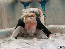 Sexy blonde gets covered in dirty mud