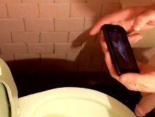 Two Twinks Are Filmed While Pissing Together In A Toilet And Jerking Off Their Shafts