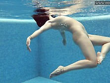 Czech babe Lady Dee takes her shorts off in the pool