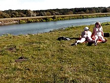 Wild beach.  Nudist beach.  Outdoors on bank of river lover screws doggy position charming hot mother I'd like to fuck Frina.  Oudo