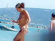 Topless Women Puts Sun Cream On Face