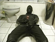 Latex Encased Person Masturbating On Toilet