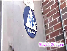 Hot black slut blows big white cock through gloryhole