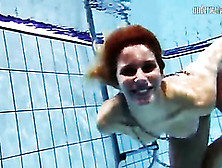 Naked teen looks lovely skinny dipping