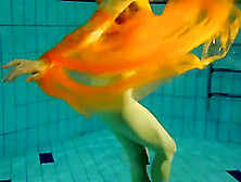 Yellow And Red Clothed Teen Underwater