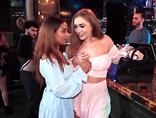 Two lesbians are playing with a toy and a real penis