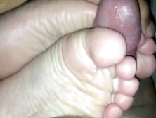 Wife uses her sexy feet to make my cock cum
