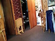 Chubby wife combing her hair in bathroom