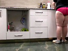 Housewife mature BBW MILF in red panties in the kitchen.