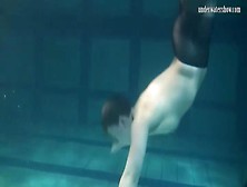 Sporty girl in black pantyhose swims erotically