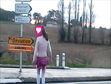 Schoolgirl Flashing On Traffic Circle Roadsigns Plugged