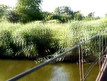 Messalina Clothed in Sun.  Outside Outdoor.  Bare Mother I'd Like To Fuck walks by bridge River.  Naturist Nudist Woman Porn Movies