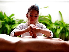 A tiny Oriental woman massages a large ramrod