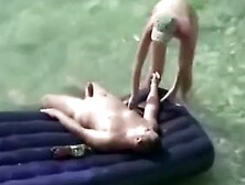 Nudist women and men have sex in the scorching sun