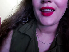 CUTE WOMAN PAINTS HER LIPS RED AND SMOKES a CIGARETTE