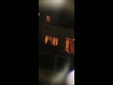 Chick undressing in window video clip