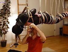 Bitch in leather catsuit gets Shibari energy tied, suspended, nipple clamps. Real uncut play!