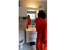 Trying on raincoats in rubber boots - large boobs