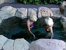 Blonde coeds get naked in pool then fuck each other
