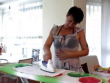 Horny housewife decides to stop ironing and engages in masturbation
