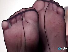 Stunning DollyC smoking a cigarette in cute lingerie and seamed african stockings