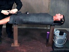 Curvy brunette with natural tits tied on desk in BDSM torture