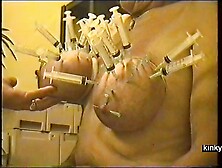 And here is my horny sow with her fat udders, pierced with a whole bunch of needles.