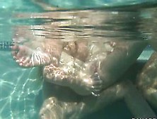 Lesbian pool hotties use toy in pool