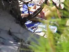 Woman Sunbathes Nude And Masturbates