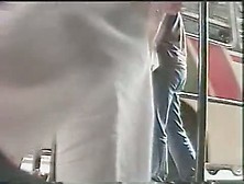 Upskirt (fake) porno of a thin brunette with a really smooth body and ass