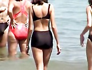 Black bikini candid girl on the crowded beach 07a