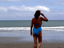 Stepmother shows off on the beach,  she makes my prick hard and takes me to satisfy me