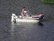 Nudist Couple Has Fun In The Middle Of A Beautiful Lake