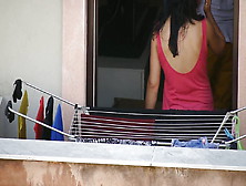 Braless Brunette While Hanging The Laundry