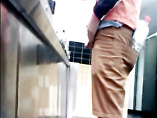 Guys In The Urinals Taking Leak.