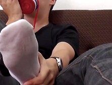 jock with a handsome foot fetish stroking and licking his feet