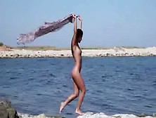 Naked Young Woman Teasing On The Coast