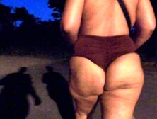 Wifey walking and flashing cheeks in park at night