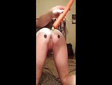 beautiful girl making an anal snowman with carrot