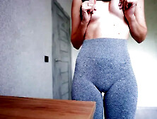 Fit Girl Rubbing Table in Yoga Pants after Gym